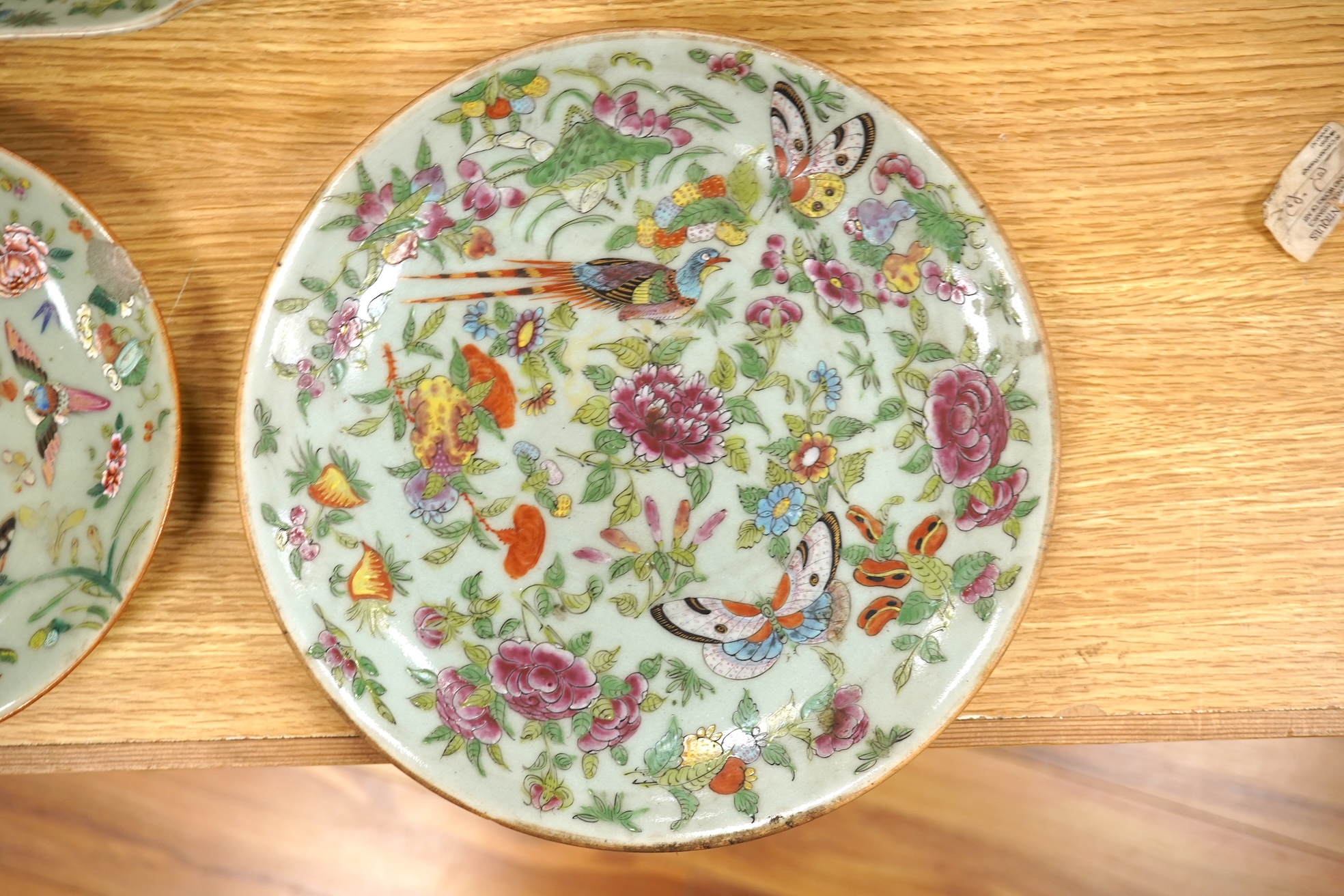 Four 19th century Chinese famille rose celadon ground dishes, largest 25cm